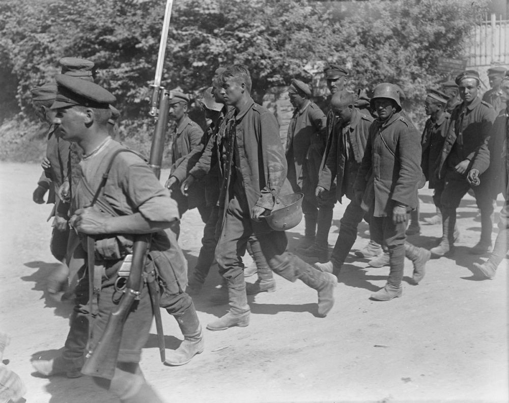New Zealand soldiers escort German prisoners into Achiet-le-Petit, Battle of Albert, 21 August 1918.